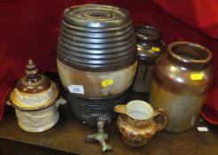 An 18th Century salt glazed stoneware ale barrel with original tap in bronze,