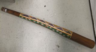 A didgeridoo with painted animal and geometric decoration