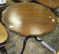 A 19th Century mahogany tea table in the Chippendale taste,
