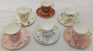 A set of six Royal Worcester cabinet cups and saucers, each with different grounds - two white,