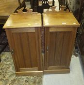 A pair of Edwardian walnut pot cupboards