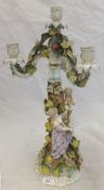 A 19th Century Sitzendorf porcelain candelabra decorated with lady and flowers and with cherub