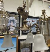 A brassed three branch ceiling light fitting in the early 20th Century taste with frosted glass