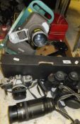 A box containing various cameras and camera equipment, slide projector, etc, to include Canon,