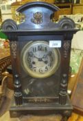 A late 19th Century walnut cased eight day mantel clock