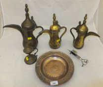 A brass Turkish/Iznik coffee pot with stamped Tughra together with a pair of 19th Century steel wick