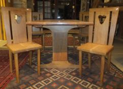 An oak refectory table and four chairs with pierced loveheart decoration to the back splats