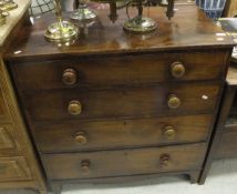 A 19th Century mahogany chest of four long drawers with turned knob handles
