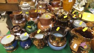 A large collection of salt-glazed harvest jugs, teapots, etc, to include Royal Doulton,