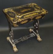 A 19th Century black lacquered and chinoiserie decorated sewing table, the shaped lid opening to