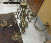 A large brass four branch electrolier in the Dutch manner