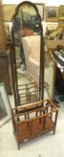 A modern mahogany framed cheval mirror, a modern mahogany Canterbury,