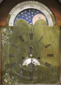 A circa 1800 oak and inlaid cased long case clock, the eight day movement with brass arched dial and