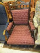 A Victorian beech framed salon armchair with red upholstery