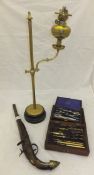 A brass oil lamp on stand,