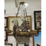 An early 20th Century gilt metal and glass hanging ceiling light of three branches with feathered