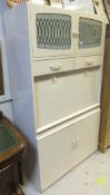 An early to mid 20th Century Remploy cream painted kitchen cabinet