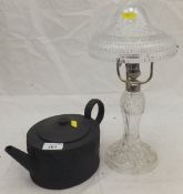 A 19th Century black basalt ware oval teapot in the Regency Wedgwood style, bears indistinct mark "
