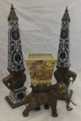 A pair of Indian brass and floral decorated porcelain columns,