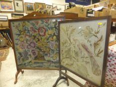 A large beech framed fire screen with floral woolwork panel,