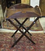 A mahogany butler's tray on associated stand