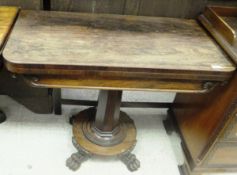 A Victorian rosewood card table on faceted column to circular base to paw feet