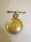 An 18 carat gold ladies pocket watch with Roman numerals and engraved floral dial and case,
