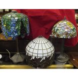 Two Tiffany style table lamps with naturalistic bases and Tiffany style shades,
