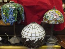 Two Tiffany style table lamps with naturalistic bases and Tiffany style shades,