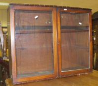 A mahogany two door glazed cabinet, a small modern pine corner cabinet,