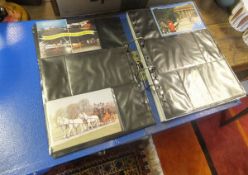 A box containing various albums and smaller boxes of various postcards