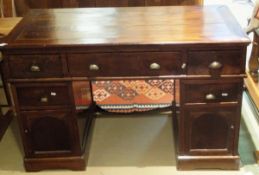 A 20th Century Indian mahogany double pedestal desk