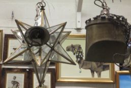 A star shaped metal and glass hanging lantern,