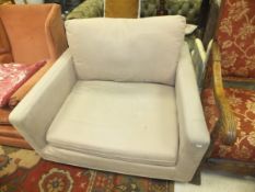 A John Lewis beige upholstered "Snuggler" chair,