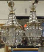 Two gilt metal ceiling light fittings with cut glass drops
