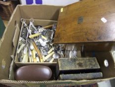 A box containing assorted cutlery, together with a mahogany and brass mounted writing slope,