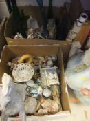 Two boxes containing assorted ornamental chinawares to include various figures etc.