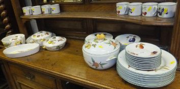 A collection of Royal Worcester "Evesham" pattern dinner and tea wares to include cups and saucers,