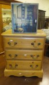 A pine bedside chest of three drawers,