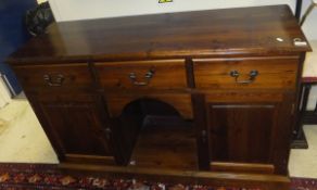 A pine dressing table with three drawers,