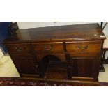 A pine dressing table with three drawers,