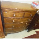 A mahogany bow fronted chest of two short over three long drawers