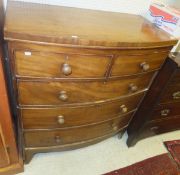 A mahogany bow fronted chest of two short over three long drawers