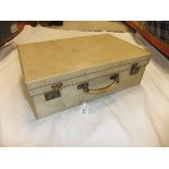A velum covered suitcase marked "MER", stamped "Finnigan's Makers Bond St London", 50.5 x 16.