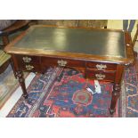 A late Victorian mahogany desk with green leather inset top and five assorted drawers on turned