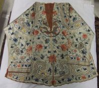 A Chinese silk kimono with embroidered floral and four claw dragon decoration