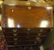 A late George III mahogany bureau,