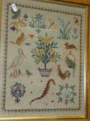 A needlework sampler featuring various animals, an orange tree, insects, flowers, etc,