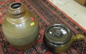 An Eddie Hopkins single handed lidded pot or casserole and a Winchcombe Pottery green/yellow