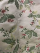 Two pairs of woven lined curtains, the gold ground decorated with berry laden sprays,